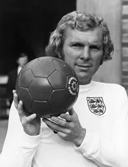 Images Dated 1st August 1970: England football captain Bobby Moore with a Wembley Club trainer football. Circa 1970