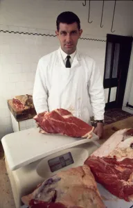 English referee jack Taylor weighing a joint of meat in his job as a butcher May English referee jack Taylor weighing a joint of meat in his job as a butcher May