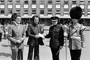 Entertainer Neil Diamond and Lord Tavistock present a cheque to the 2nd Battalion Entertainer Neil Diamond and Lord Tavistock present a cheque to the 2nd Battalion