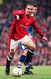 Eric Cantona fends off a Leicester defender during their match at Old Trafford Eric Cantona fends off a Leicester defender during their match at Old Trafford