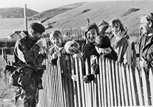 FALKLANDS WAR TASK FORCE - SOLDIER TALKING TO CHILDREN & DRINKING HOT DRINK - April 1982 FALKLANDS WAR TASK FORCE - SOLDIER TALKING TO CHILDREN & DRINKING HOT DRINK - April 1982
