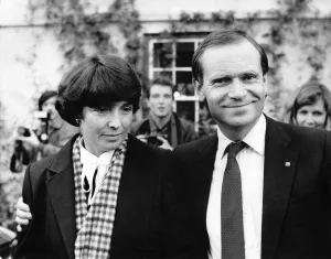 Fallen Tory Jeffrey Archer puts a comforting arm around his wife Mary. October 1986 Fallen Tory Jeffrey Archer puts a comforting arm around his wife Mary. October 1986