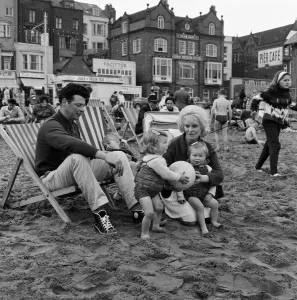 A family enjoying a holiday on the beach at Scarborough, North Yorkshire. May 1964 A family enjoying a holiday on the beach at Scarborough, North Yorkshire. May 1964