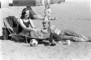 A family enjoying the hot weather at Margate Beach. April 1975 75-2073-004 A family enjoying the hot weather at Margate Beach. April 1975 75-2073-004
