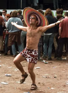 A fan does a dance at the Glastonbury Festival 1999 wearing sombrero A fan does a dance at the Glastonbury Festival 1999 wearing sombrero