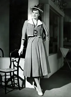 Fashion 1940s Model wearing a Bolero Pleated skirt suit Fashion 1940s Model wearing a Bolero Pleated skirt suit