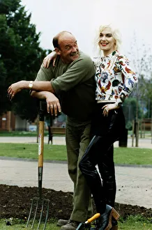 Fashion designer Pam Hogg standing with her arm around gardener Willie Hall who is Fashion designer Pam Hogg standing with her arm around gardener Willie Hall who is