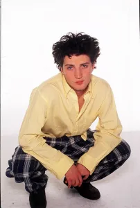 Fashion - Model Kate Moss brother Nick crouching wearing tartan style trousers Fashion - Model Kate Moss brother Nick crouching wearing tartan style trousers