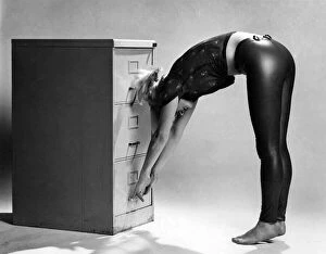 Images Dated 6th July 1979: Filing Cabinet: Remove shoes. Face cabinet with arms outstretched