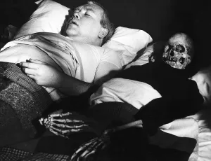 Films Under Milk Wood starring in a scene is actor Ray Smith with his skeleton wife in Films Under Milk Wood starring in a scene is actor Ray Smith with his skeleton wife in