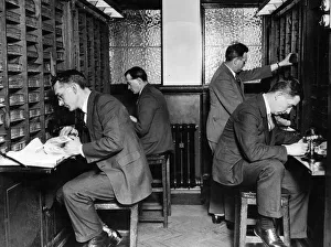 Finger Print Department. Section of search room, officers searching records Finger Print Department. Section of search room, officers searching records