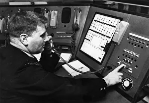 Fireman demonstrates new electronic private circuit system installed in Control Room at Fireman demonstrates new electronic private circuit system installed in Control Room at