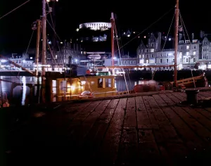 Fishing boats in harbour February 1979 at night in Oban scotland Fishing boats in harbour February 1979 at night in Oban scotland