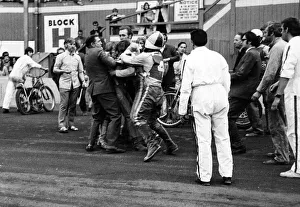 Flare up at Belle Vue. Officials rush in to separate Belle Vue rider Alan Wilkinson Flare up at Belle Vue. Officials rush in to separate Belle Vue rider Alan Wilkinson