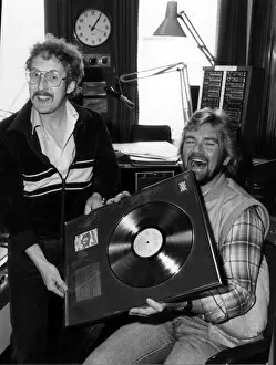 Images Dated 1st May 1981: Folk singer Fred Wedlock with DJ Noel Edmonds. With gold record. Circa 1981
