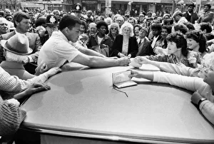 Fomer world boxing champion Muhammad Ali signs autographs for his Birmingham fans on his Fomer world boxing champion Muhammad Ali signs autographs for his Birmingham fans on his