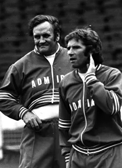 Football manager Don Revie with Alan Ball hand to ear wearing a track suit 1977 Football manager Don Revie with Alan Ball hand to ear wearing a track suit 1977