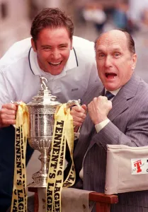Footballer Ally McCoist and Robert Duvall with the Scottish Cup Footballer Ally McCoist and Robert Duvall with the Scottish Cup