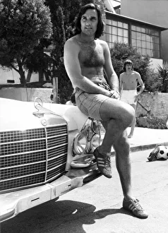 Footballer George Best poses beside his Mercedes Car June 1976 Footballer George Best poses beside his Mercedes Car June 1976