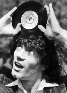 Footballer Kevin Keegan with the record he has cut called Head over Heels in Love Footballer Kevin Keegan with the record he has cut called Head over Heels in Love