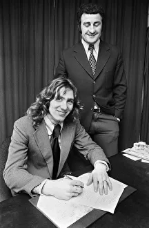 Footballer Robin Friday with Reading FC manager Charlie Hurley after signing a Footballer Robin Friday with Reading FC manager Charlie Hurley after signing a