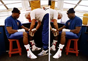Frank Bruno Boxer sitting on stall having a bandage put on his hands Frank Bruno Boxer sitting on stall having a bandage put on his hands