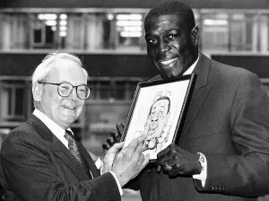 Frank Bruno Boxing receives the Cartoonists Club Joker of the Year Award 1993 from his Frank Bruno Boxing receives the Cartoonists Club Joker of the Year Award 1993 from his