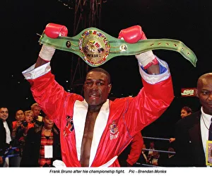 Frank Bruno hold aloft his WBC World Boxing Council Championship belt after defeating Frank Bruno hold aloft his WBC World Boxing Council Championship belt after defeating