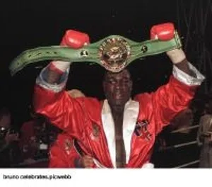 Frank Bruno holds up his WBC world title belt after he had beaten Oliver McCall in his Frank Bruno holds up his WBC world title belt after he had beaten Oliver McCall in his