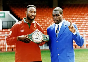 Frank Bruno with Lennox Lewis boxers Lewis holding WBC world championship belt at Cardiff Frank Bruno with Lennox Lewis boxers Lewis holding WBC world championship belt at Cardiff