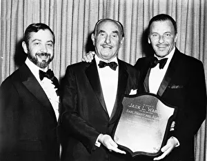 Frank Sinatra with friends holding a shield to tribute the Warner Brothers Frank Sinatra with friends holding a shield to tribute the Warner Brothers