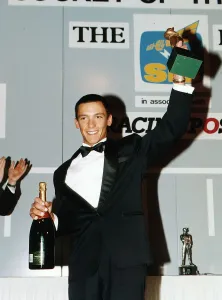 Frankie Dettori race horse jockey holds trophy and champagne Dbase Frankie Dettori race horse jockey holds trophy and champagne Dbase