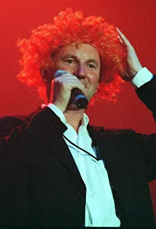 Fred MacAulay comedian wears orange curly wig May 1999 at the Scotland Rocks for Kosovo Fred MacAulay comedian wears orange curly wig May 1999 at the Scotland Rocks for Kosovo