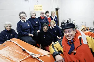 Gareth Wigmore, a RNLI crew member pictured with women who helped raise money to build a Gareth Wigmore, a RNLI crew member pictured with women who helped raise money to build a