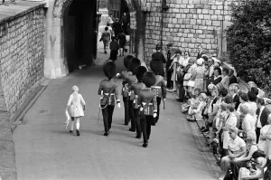 Garter Procession at Windsor Castle. A little girl joins the Guards as they march into Garter Procession at Windsor Castle. A little girl joins the Guards as they march into