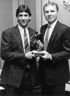 Gary Lineker receives his footballer of the year trophy drom Bobby Moore. 9th May 1986 Gary Lineker receives his footballer of the year trophy drom Bobby Moore. 9th May 1986