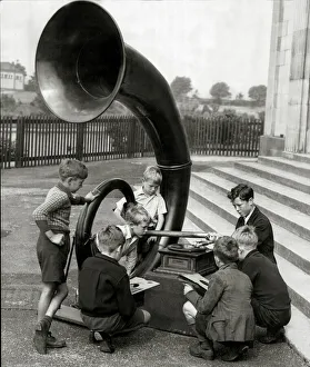 Gathering of young lads with a giant antiquated gramphone. 11th July 1944 Gathering of young lads with a giant antiquated gramphone. 11th July 1944