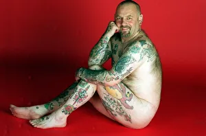 Gavin Boyra - Tattoo man sitting on floor naked tattoos on legs arms and back. April 1997 Gavin Boyra - Tattoo man sitting on floor naked tattoos on legs arms and back. April 1997
