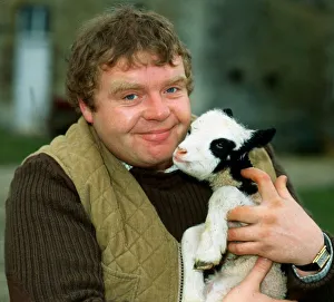 Geoffrey Hughes holding baby goat April 1982 Geoffrey Hughes holding baby goat April 1982