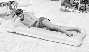 George Best Football Player Relaxing on an inflatable bed on holiday George Best Football Player Relaxing on an inflatable bed on holiday