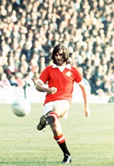 George Best Manchester United Footballer kicking ball 1973 George Best Manchester United Footballer kicking ball 1973
