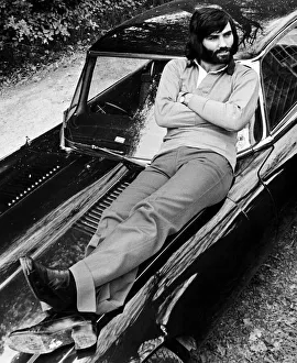George Best relaxes on car after a drive in the country May 1974 D. Hutchinson George Best relaxes on car after a drive in the country May 1974 D. Hutchinson