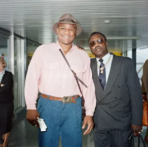 George Foreman and Joe Frazier at London Airport. 16th October 1989 George Foreman and Joe Frazier at London Airport. 16th October 1989