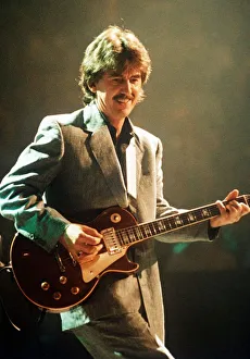 George Harrison ex Beatles Playing the guitar at the Gary Moore concert at the Royal George Harrison ex Beatles Playing the guitar at the Gary Moore concert at the Royal