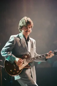George Harrison ex Beatles Playing the guitar at the Gary Moore concert at the Royal George Harrison ex Beatles Playing the guitar at the Gary Moore concert at the Royal