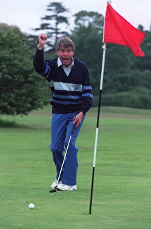 George King celebrates his scratchcard jackpot on the golfcourse after he George King celebrates his scratchcard jackpot on the golfcourse after he