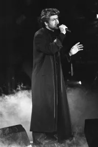 George Michael performing at the Stand by Me: AIDS Day Benefit concert at Wembley Arena George Michael performing at the Stand by Me: AIDS Day Benefit concert at Wembley Arena