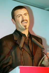 George Michael the singer collects his award at the 'Help A London Child" George Michael the singer collects his award at the 'Help A London Child"