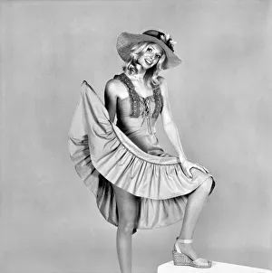 German glamour model Maureen wearing a short sleeved frilly dress and hat German glamour model Maureen wearing a short sleeved frilly dress and hat