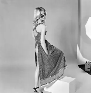 German glamour model Maureen wearing a sleeveless open backdress. April 1975 German glamour model Maureen wearing a sleeveless open backdress. April 1975